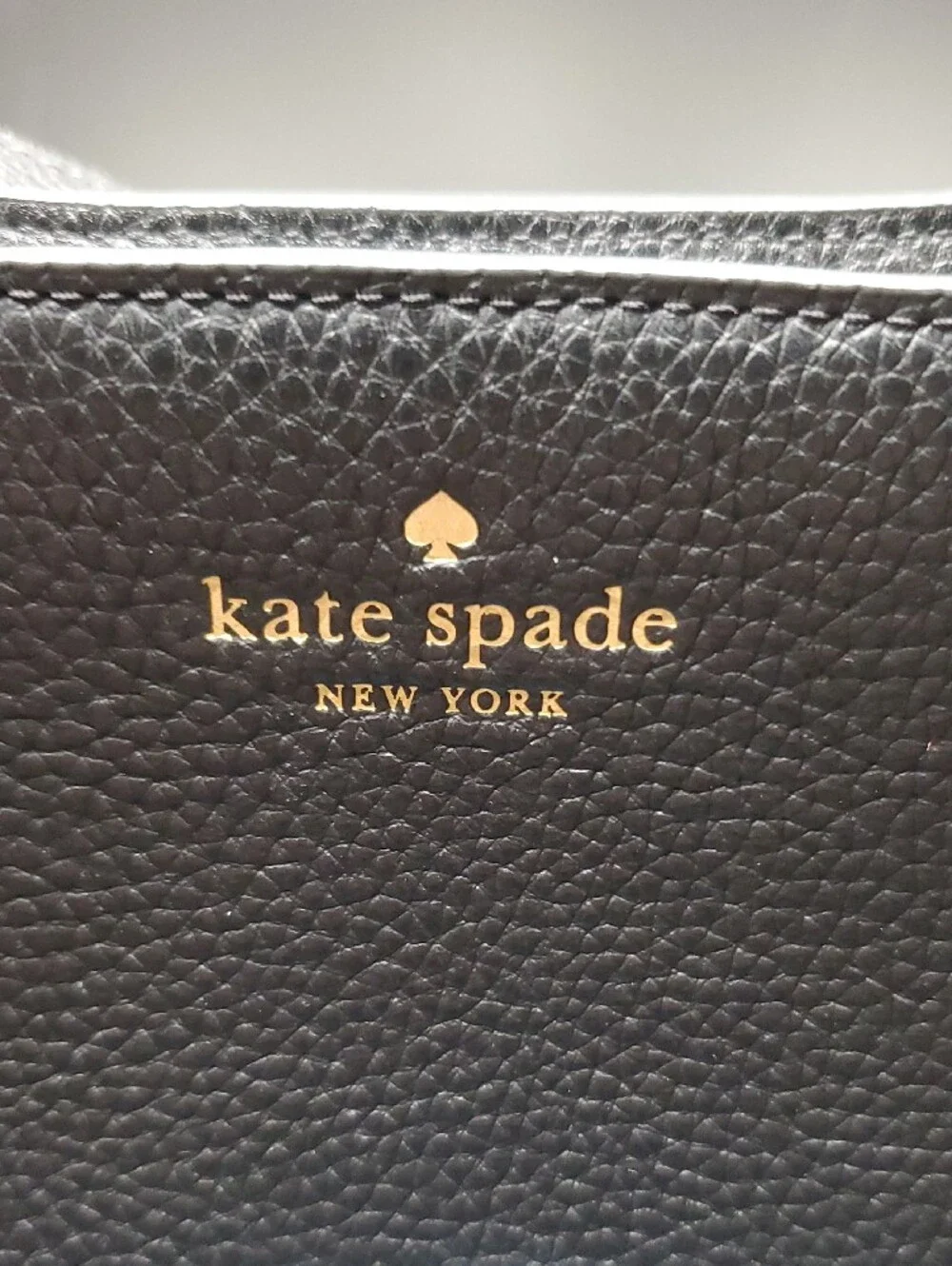 Kate Spade black pebbled leather shoulder bag with gold logo